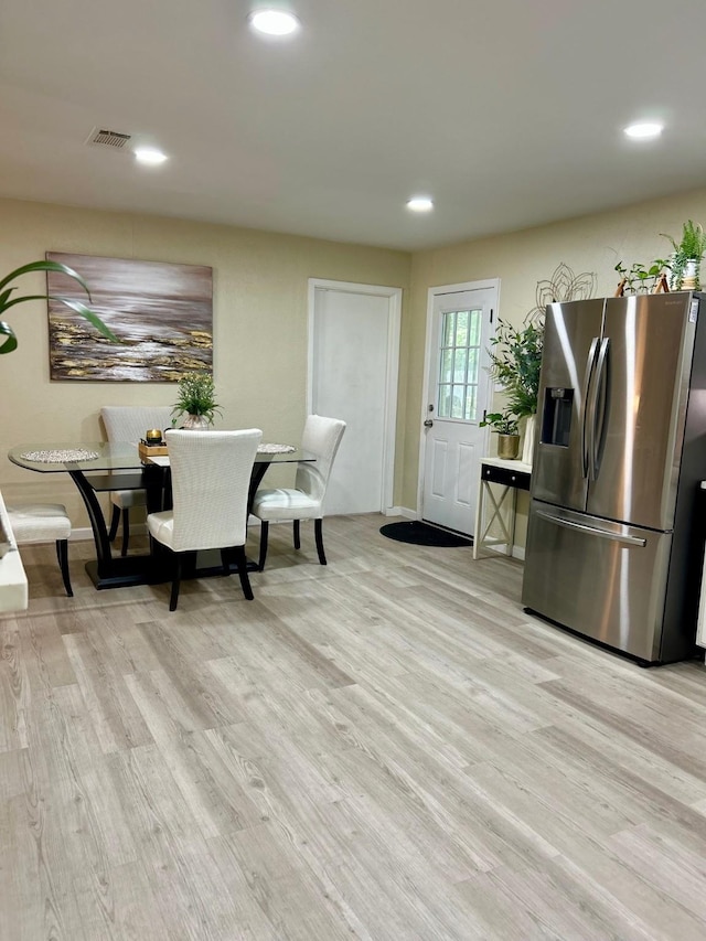 307 E 5th St, Kaufman, TX 75142 - dining room with light wood-type flooring and recessed lighting