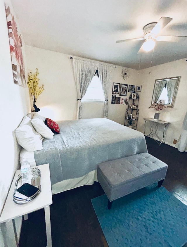 307 E 5th St, Kaufman, TX 75142 - bedroom featuring wood finished floors and a ceiling fan