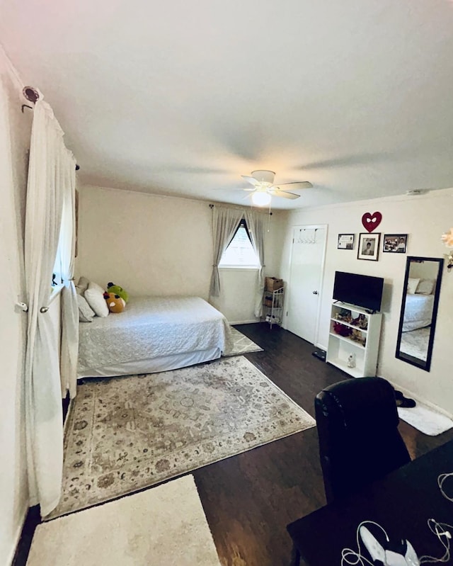 307 E 5th St, Kaufman, TX 75142 - bedroom with a ceiling fan and dark wood-style flooring