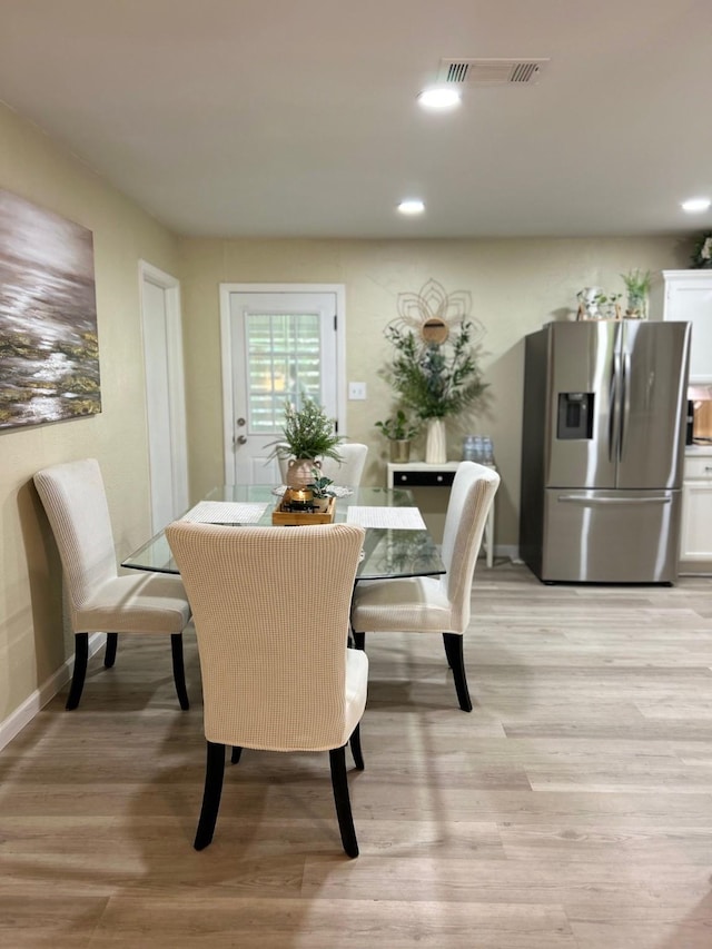 307 E 5th St, Kaufman, TX 75142 - dining room featuring light wood-style floors and recessed lighting