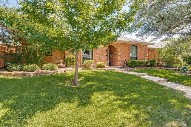 6211 White Rose Trl, Dallas, TX 75248 - view of front of home with a front lawn and brick siding