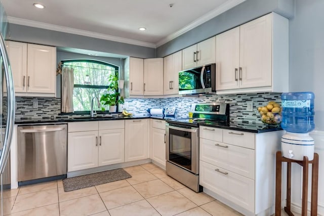 6211 White Rose Trl, Dallas, TX 75248 - kitchen featuring appliances with stainless steel finishes, dark countertops, white cabinetry, tasteful backsplash, and ornamental molding