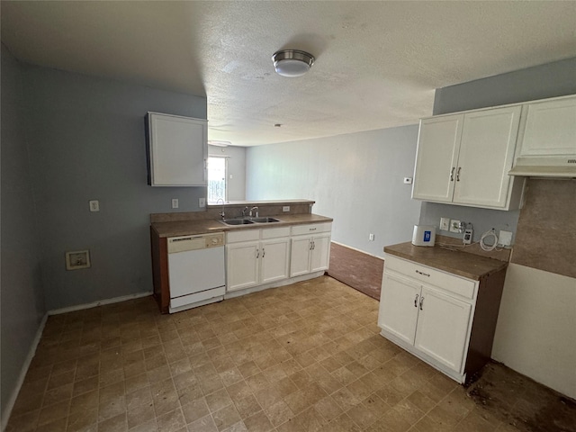 3048 Saint Ursula Dr, Dallas, TX 75233 - kitchen featuring white dishwasher, white cabinets, a peninsula, light floors, and a textured ceiling