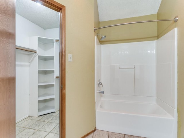 10200 Pack Saddle Ct, Fort Worth, TX 76108 - bathroom with a textured ceiling, tile patterned flooring, and tub / shower combination