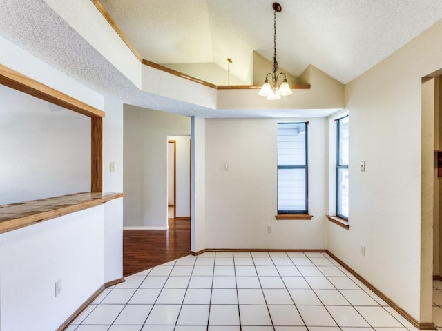 10200 Pack Saddle Ct, Fort Worth, TX 76108 - empty room with vaulted ceiling, a chandelier, and a textured ceiling