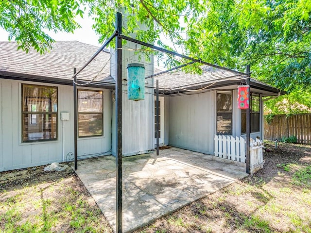 10200 Pack Saddle Ct, Fort Worth, TX 76108 - back of house featuring roof with shingles and a patio