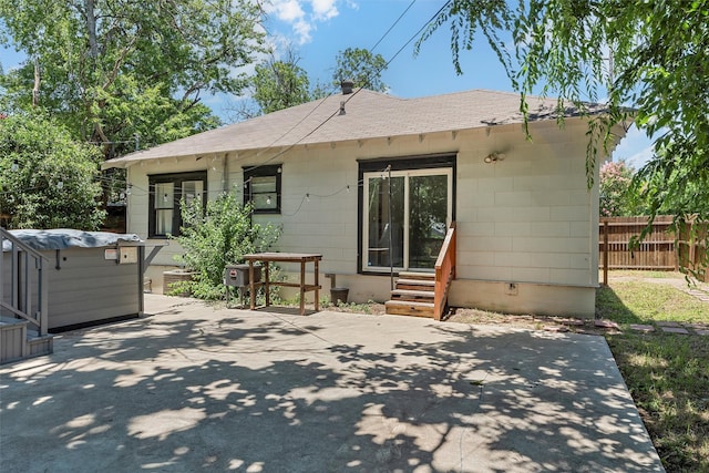 2700 Ethel Ave, Waco, TX 76707 - back of house with a patio, entry steps, and a shingled roof