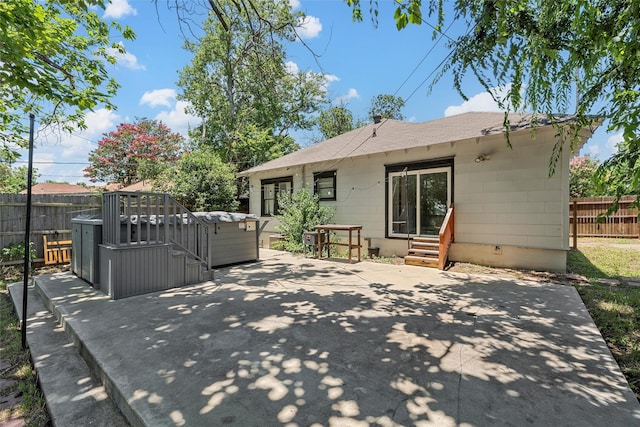 2700 Ethel Ave, Waco, TX 76707 - rear view of house with entry steps, a patio, and a shingled roof