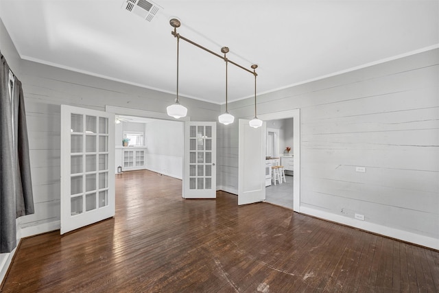 2700 Ethel Ave, Waco, TX 76707 - unfurnished room featuring french doors, crown molding, hardwood / wood-style floors, and wood walls