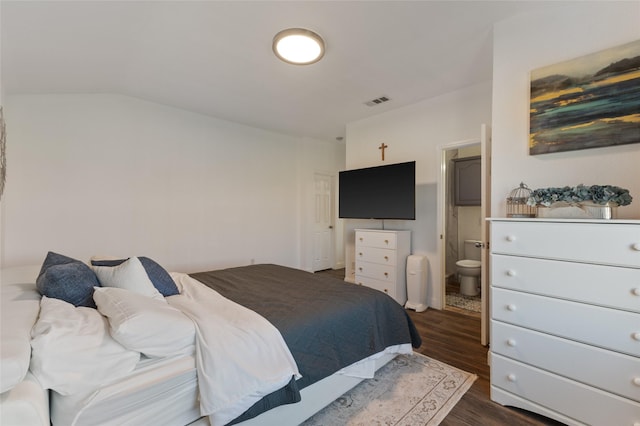 502 Austin Ln, Lavon, TX 75166 - bedroom with dark wood finished floors, vaulted ceiling, and ensuite bathroom