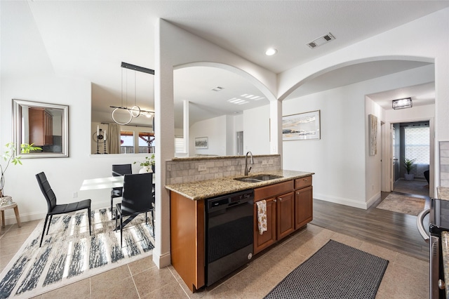 502 Austin Ln, Lavon, TX 75166 - kitchen with dishwasher, light stone counters, plenty of natural light, tasteful backsplash, and recessed lighting