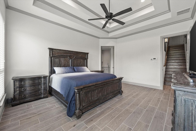 1005 Sinopa St, Caddo Mills, TX 75135 - bedroom with a raised ceiling, light wood finished floors, crown molding, and ceiling fan