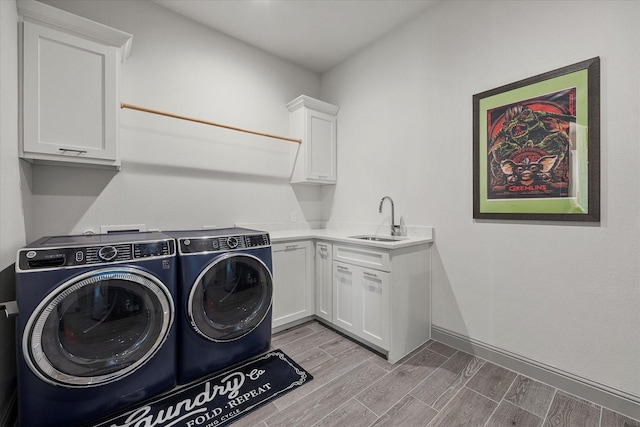 1005 Sinopa St, Caddo Mills, TX 75135 - washroom featuring washer and clothes dryer, cabinet space, and wood finished floors