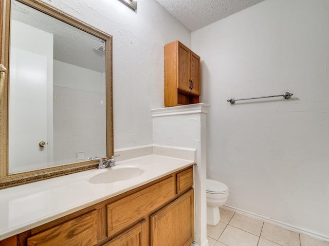 2705 Independence Dr, Mesquite, TX 75150 - bathroom with a textured ceiling, vanity, and tile patterned flooring
