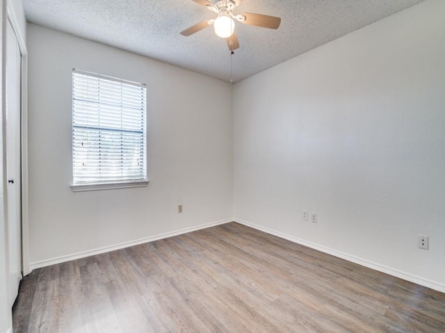 2705 Independence Dr, Mesquite, TX 75150 - spare room featuring wood finished floors, a textured ceiling, and a ceiling fan
