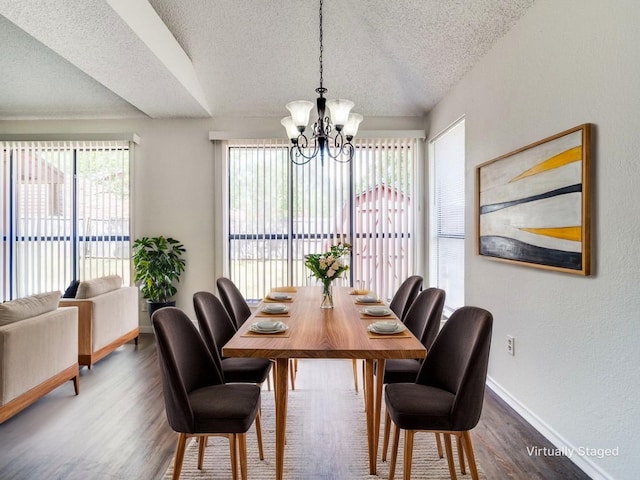 2705 Independence Dr, Mesquite, TX 75150 - dining area with a textured ceiling, dark wood-style floors, and a chandelier