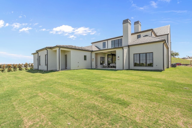4532 Terroir Dr, Fort Worth, TX 76126 - back of property with ceiling fan, a yard, a chimney, and a patio