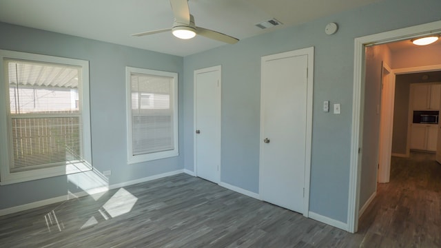1619 Baylor Ave, Waco, TX 76706 - unfurnished bedroom featuring wood finished floors and ceiling fan