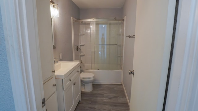 1619 Baylor Ave, Waco, TX 76706 - full bathroom featuring vanity, wood finished floors, and enclosed tub / shower combo