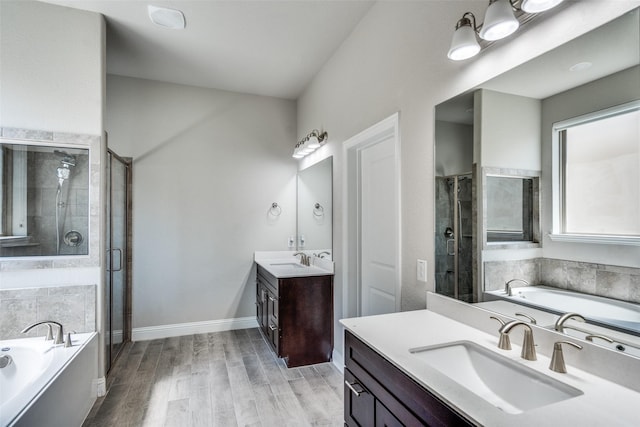 6105 Horsetail Dr, Mckinney, TX 75071 - full bath with two vanities, a shower stall, and a garden tub
