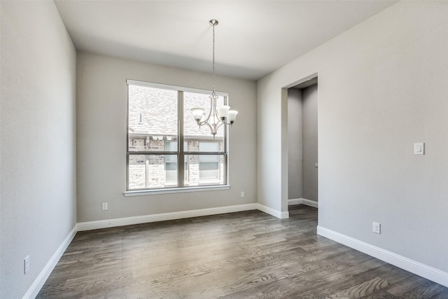 6105 Horsetail Dr, Mckinney, TX 75071 - empty room featuring a chandelier and dark wood finished floors