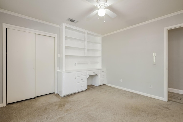 1203 Woodridge Cir, Euless, TX 76040 - unfurnished bedroom with light carpet, crown molding, built in study area, a ceiling fan, and a closet