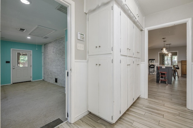 1203 Woodridge Cir, Euless, TX 76040 - corridor featuring attic access and light wood finished floors