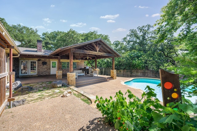 1203 Woodridge Cir, Euless, TX 76040 - view of pool with a fenced backyard, a patio, french doors, and area for grilling