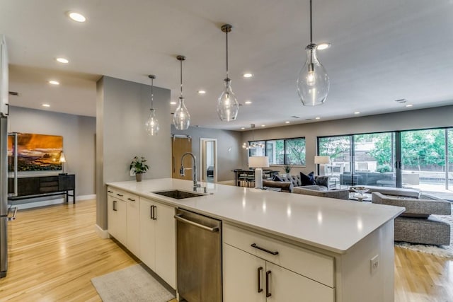 3866 Lively Ln, Dallas, TX 75220 - kitchen with open floor plan, dishwasher, light countertops, light wood-style flooring, and recessed lighting
