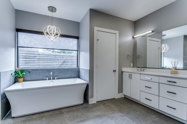 3866 Lively Ln, Dallas, TX 75220 - full bathroom featuring vanity, a soaking tub, and a chandelier