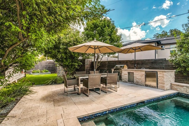 3866 Lively Ln, Dallas, TX 75220 - fenced backyard featuring an outdoor kitchen, a patio area, and outdoor dining area