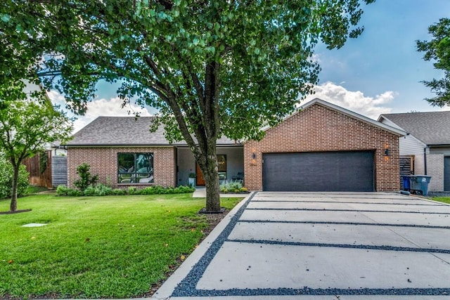 3866 Lively Ln, Dallas, TX 75220 - view of front of home with brick siding, an attached garage, driveway, and a front lawn