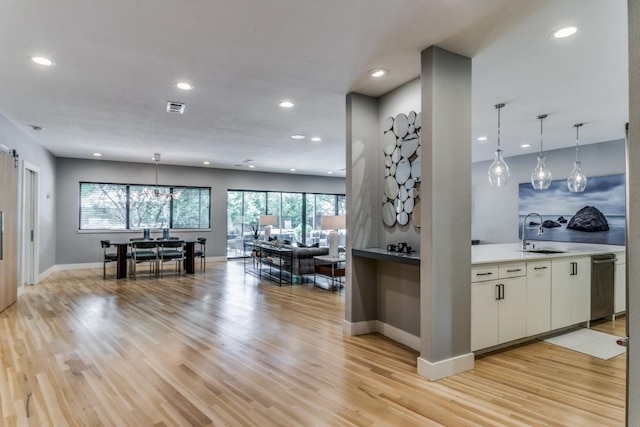 3866 Lively Ln, Dallas, TX 75220 - bar with dishwasher, recessed lighting, light wood-style flooring, and hanging light fixtures