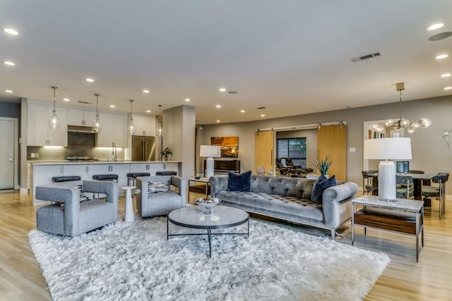 3866 Lively Ln, Dallas, TX 75220 - living area with light wood-style floors, recessed lighting, and a chandelier