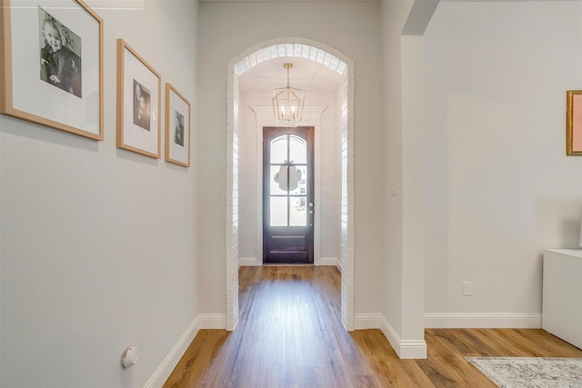 113 Observation Dr W, Aledo, TX 76008 - foyer featuring light wood-style floors, arched walkways, and a chandelier