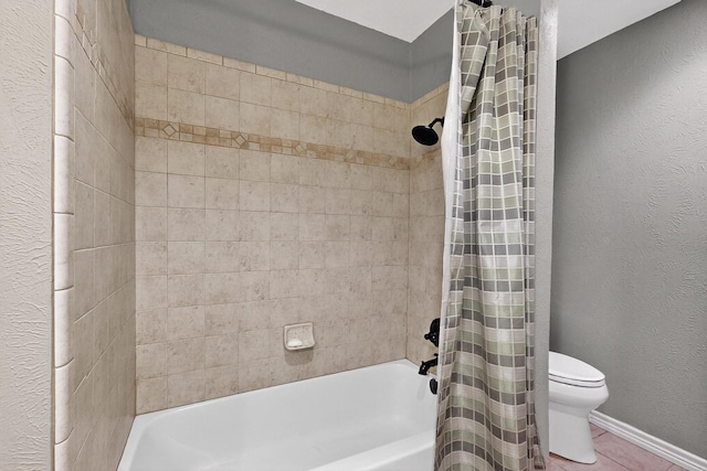 3302 Janwood Ln, Garland, TX 75044 - bathroom featuring shower / tub combo, tile patterned flooring, and a textured wall