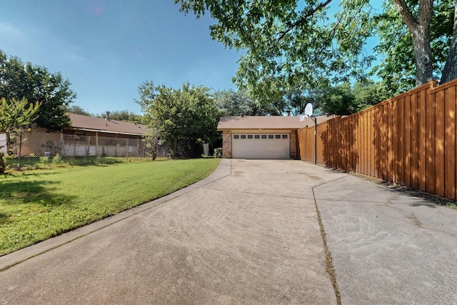 3302 Janwood Ln, Garland, TX 75044 - view of yard with concrete driveway and a garage