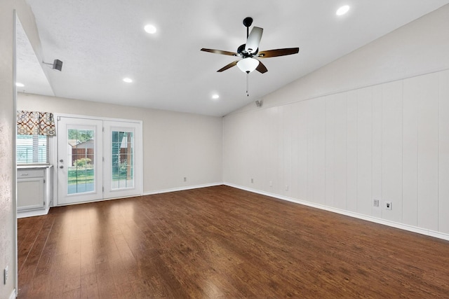 3302 Janwood Ln, Garland, TX 75044 - spare room featuring dark wood-type flooring, a ceiling fan, vaulted ceiling, and recessed lighting