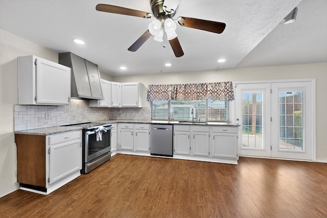 3302 Janwood Ln, Garland, TX 75044 - kitchen with appliances with stainless steel finishes, dark wood-type flooring, wall chimney exhaust hood, backsplash, and light stone counters