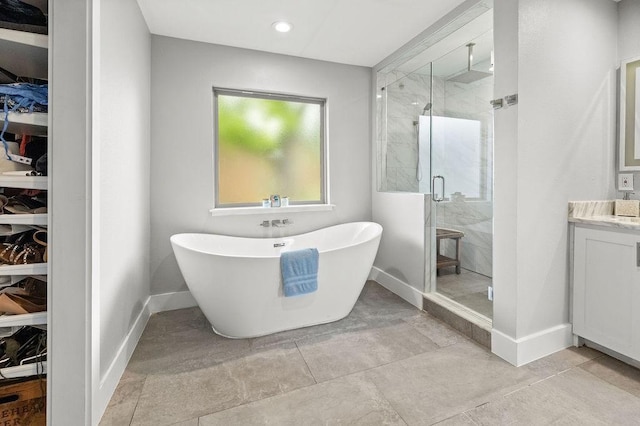 6005 Costera Ln, Dallas, TX 75248 - full bathroom featuring a shower stall, a freestanding bath, vanity, and recessed lighting