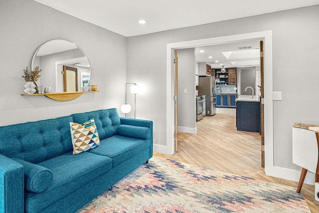 6005 Costera Ln, Dallas, TX 75248 - living room featuring light wood-style floors and recessed lighting