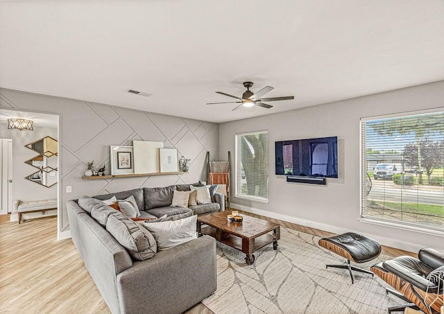 6005 Costera Ln, Dallas, TX 75248 - living area featuring healthy amount of natural light, light wood-style flooring, and a ceiling fan