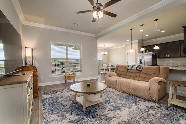 206 Berkshire Pl, Haughton, LA 71037 - living room featuring wood finished floors, ceiling fan, crown molding, a chandelier, and recessed lighting