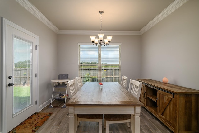 206 Berkshire Pl, Haughton, LA 71037 - dining room featuring light wood-type flooring, a chandelier, and ornamental molding