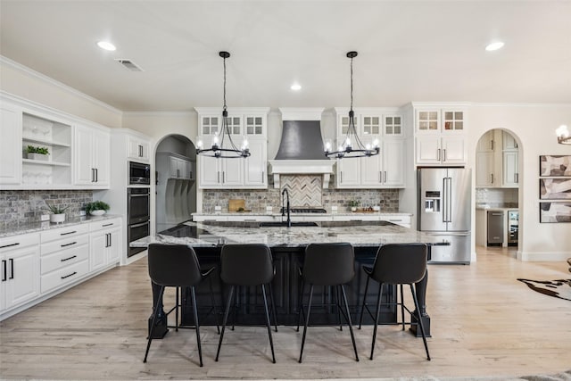 1030 Double B Trl, Prosper, TX 75078 - kitchen featuring high quality fridge, custom exhaust hood, a chandelier, built in microwave, and crown molding