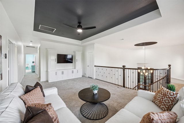 1030 Double B Trl, Prosper, TX 75078 - living room with a raised ceiling, ceiling fan, a chandelier, and light carpet