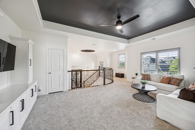 1030 Double B Trl, Prosper, TX 75078 - living area featuring light carpet, a raised ceiling, and a ceiling fan
