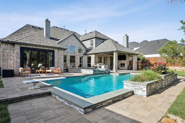 1030 Double B Trl, Prosper, TX 75078 - view of pool with a patio area, an outdoor living space with a fireplace, and a diving board
