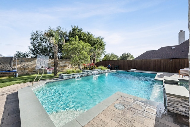 1030 Double B Trl, Prosper, TX 75078 - view of pool featuring a trampoline and a fenced backyard
