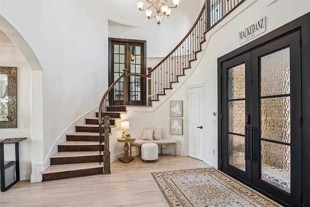 1030 Double B Trl, Prosper, TX 75078 - foyer with french doors, stairway, wood finished floors, and a high ceiling